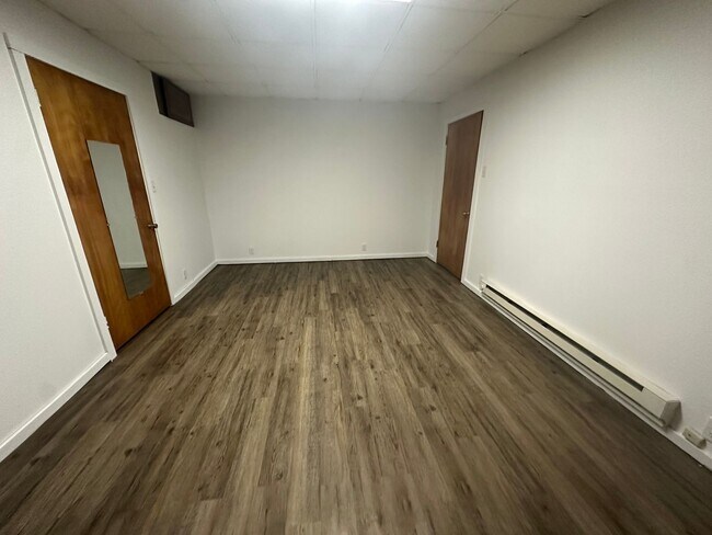 Building Photo - Modern & Efficient 2-Bedroom with Stylish Vinyl Plank Flooring
