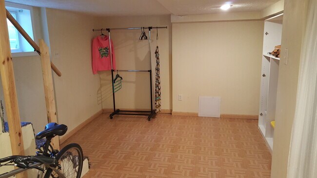 BONUS: Basement room is finished, has closet, and could easily be second bedroom if door was added. - 120 Weldon Street