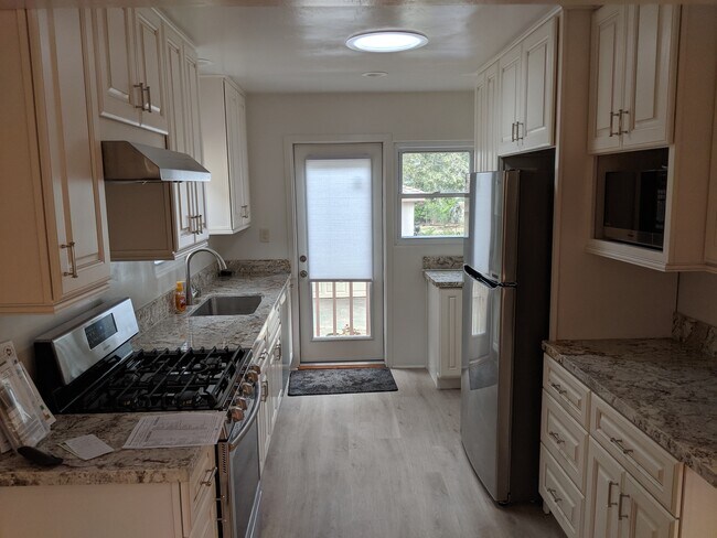 Remodeled Kitchen to Back Door - 2007 Venice St