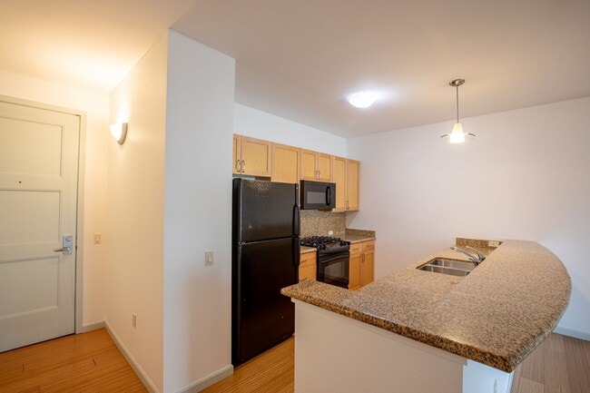 Photo - Sweet + secure 1/1 condo with parking, extra storage room + AC available now!