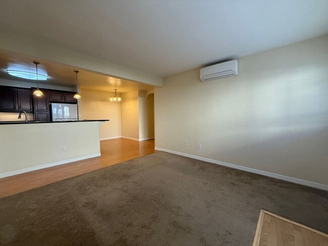 Building Photo - Upgraded Condo with Private Patio, AC, Pool, Gym, and Covered Parking in Gated Community