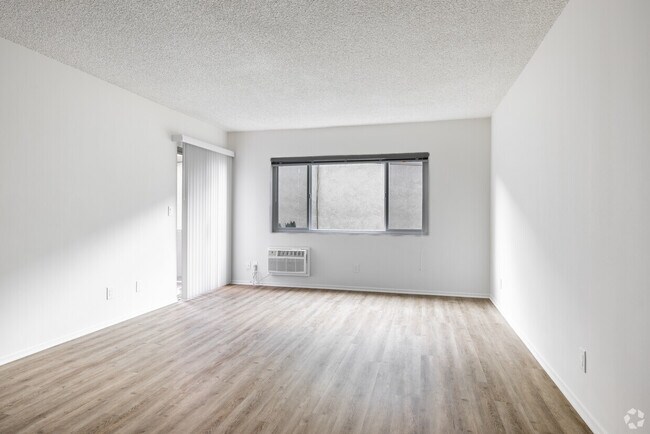 1BR, 1BA - 785SF - Living Room - Cedar Tropics