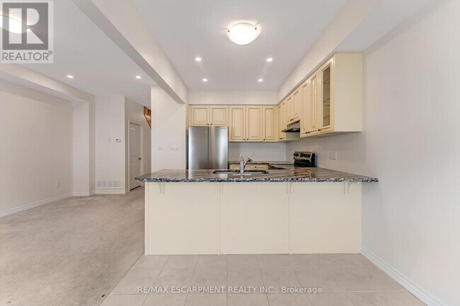 Photo du bâtiment - 515-515 Garner Rd W