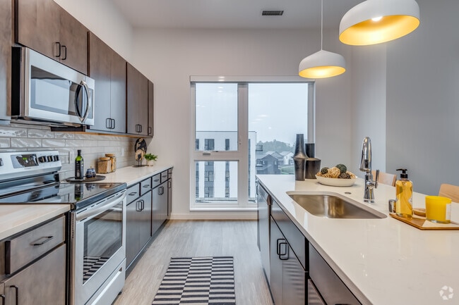 2 BR, 2 BA - 1,198SF - Kitchen - COAST at Lakeshore Commons
