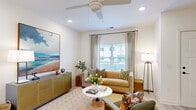 Located in Leland, NC, this two-story home on Goose Island Drive is designed with a clean, contemporary aesthetic throughout. The main level features light-toned luxury vinyl plank flooring that flows seamlessly from room to room, anchored by a well-equipped kitchen showcasing sage-green shaker cabinets, white quartz countertops, a subway tile backsplash, stainless steel appliances, and a walk-in pantry for added storage. An open living area connects to the staircase, creating an easy flow between levels and bathing the space in natural light. Upstairs, the home continues with plush carpeted bedrooms, each featuring ceiling fans, generous closet space, and bright windows with neighborhood views. The primary bath impresses with a lengthy dual-vanity finished in sage cabinetry and white quartz, complemented by light wood-look flooring. A secondary bathroom includes a tiled walk-in shower and coordinating finishes. Additional bedrooms offer walk-in closets and a relaxed, airy ambiance. Throughout the home, a neutral palette, recessed lighting, and thoughtful details create a cohesive, move-in-ready environment well-suited for comfortable everyday living.