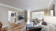 Located at 1333 Eldridge Pkwy in Houston, TX, this single-floor, 2-bedroom, 2-bathroom home offers a thoughtfully designed layout with a warm, neutral color palette and quality finishes throughout. The welcoming entrance leads into hallways adorned with crown molding, setting an elegant tone carried through the entire space.

The bright and open living room is a standout feature, with large windows flooding the area with natural light and rich hardwood-style flooring underfoot. Crown molding adds a refined architectural detail to the living and dining areas, which flow seamlessly together for easy everyday living.

The kitchen is well-equipped with rich cherry-toned cabinetry, stainless steel appliances including a refrigerator with ice maker, a central island for additional prep space, and a window above the sink that brings in natural light. A dedicated pantry provides generous storage.

Both bedrooms are carpeted and feature natural light from windows with blinds. The spacious primary bedroom includes a ceiling fan and access to a generous walk-in closet with wire shelving systems. The second bedroom is equally comfortable with ample closet space.

The two bathrooms are clean and functional, featuring tub-shower combinations. A dedicated laundry room houses a full-size washer and dryer. Three closets in total ensure storage is never a concern throughout this well-organized home.
