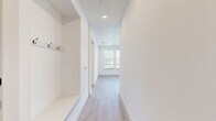 Located at 405 E Ash St in Celina, TX, this well-designed single-story home offers 2 bedrooms and 2 bathrooms with a clean, contemporary aesthetic throughout. The open-concept kitchen is a standout feature, boasting crisp white shaker cabinetry, granite countertops, a central island with pendant lighting, white subway tile backsplash, and a full suite of stainless steel appliances including a refrigerator, range, microwave, and dishwasher. Light hardwood-style flooring flows through the main living areas and kitchen, lending warmth and continuity to the space. The primary bedroom features vaulted ceilings, plush carpet, a ceiling fan, and natural light from dual windows, with direct access to both a walk-in closet and a private en-suite bathroom. The primary bath offers a double-sink granite vanity with matte black fixtures and a glass-enclosed walk-in shower with tile surround. The second bedroom is equally bright, with carpet flooring, a ceiling fan, and outdoor views. The second bathroom includes a tub-shower combo with tile surround, granite vanity, and matching black hardware. Two hallways and two closets complete the efficient and functional layout of this modern Celina home.
