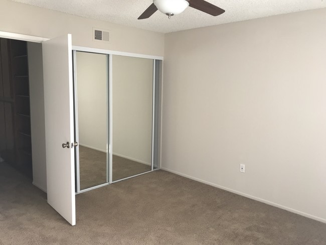 Ceiling Fan and Mirrored Closet - Harbor Bluffs Apartments