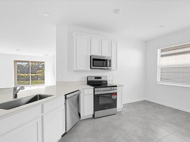 Foto del edificio - 4391 Pebbles Throw Dr