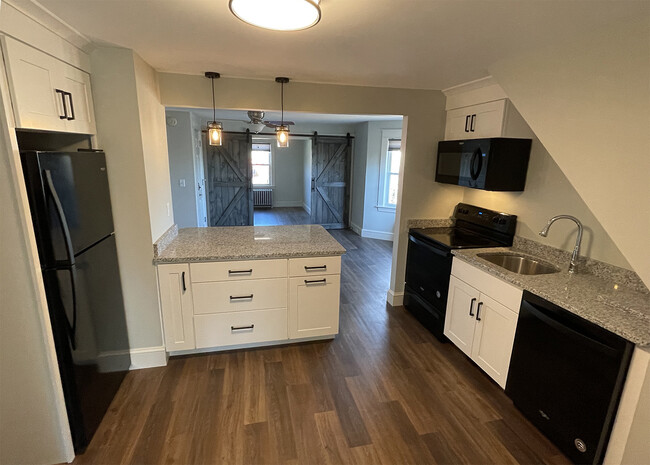 Kitchen opens into Living area - 214 Myrtle Ave