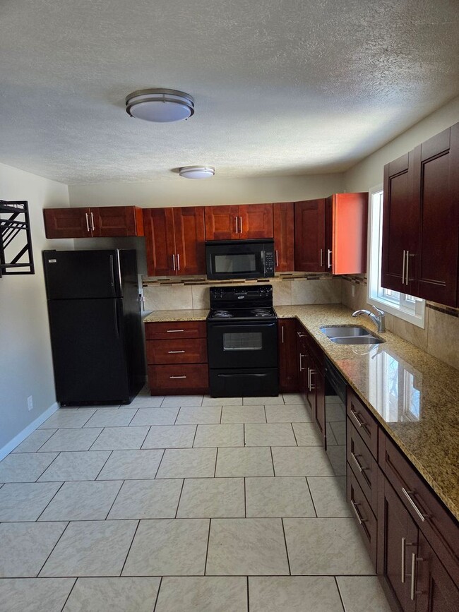 Photo - 4 bed 2.5 bath with a 2 car garage and fenced backyard House