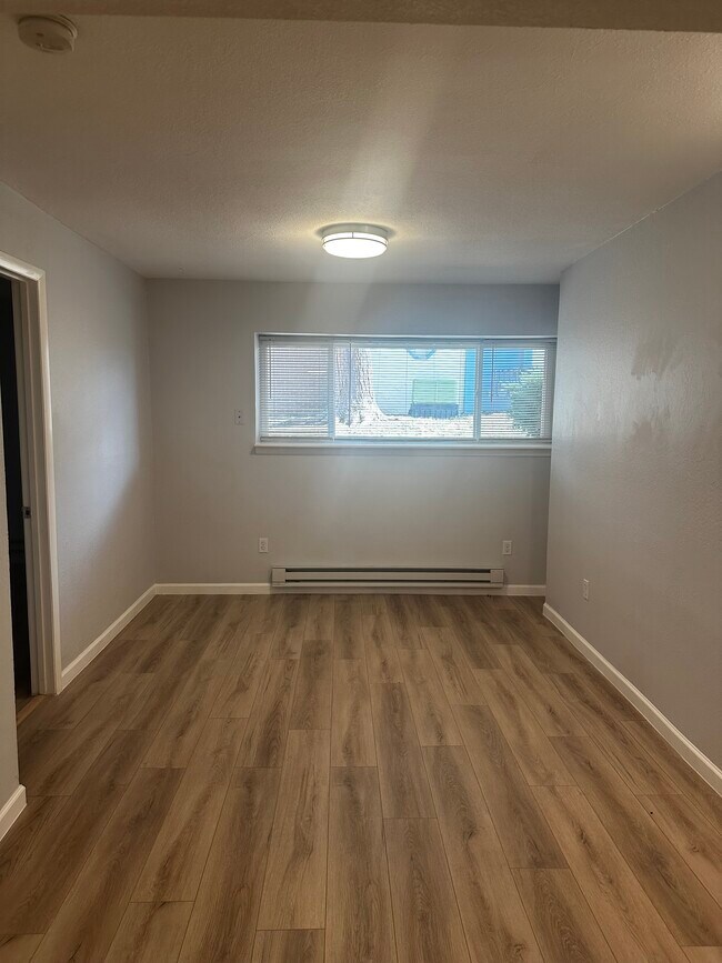 Perfect size living room with a picture window to the courtyard. - 12170 Huron St