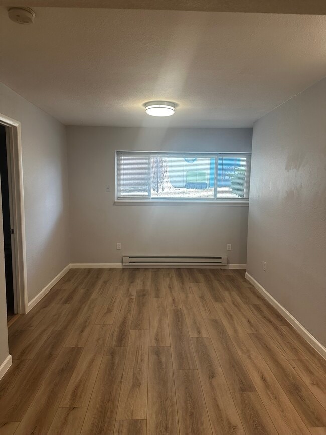Perfect size living room with a picture window to the courtyard. - 12170 Huron St