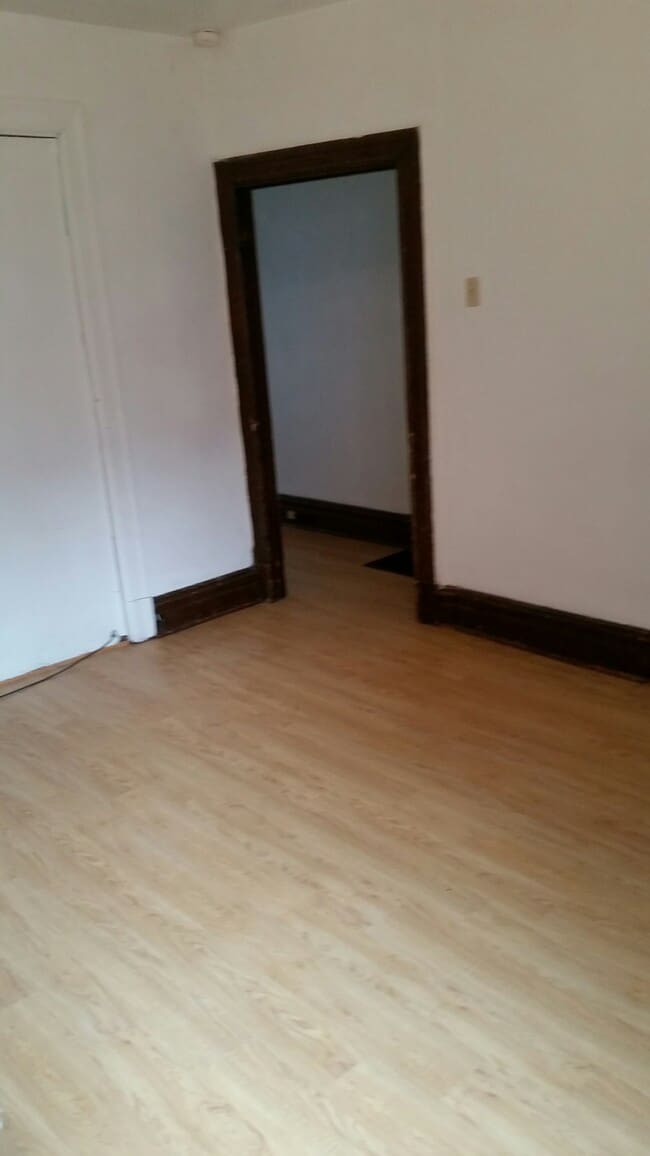 Living Room with new flooring - 324 Semple St