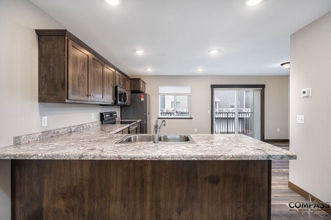 Building Photo - SPACIOUS AND MODERN TOWNHOME