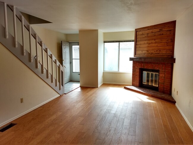 Living room wood floors fireplace - 4255 Westshore Way