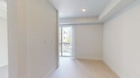 Located at 2330 Union Street, Unit 275 in Fort Myers, Florida, this one-bedroom, one-bathroom residence offers a clean, modern design with a bright and cohesive aesthetic throughout. Light-toned flooring flows seamlessly across the entire unit, complementing the crisp white walls and creating an airy, open feel.

The galley-style kitchen is well-appointed with white cabinetry, white quartz countertops, stainless steel appliances including a French door refrigerator, electric range, built-in microwave, and dishwasher. Recessed lighting above ensures the space remains bright and functional.

The open living area connects naturally to the rest of the unit, with a structural column adding architectural definition to the space. The generously sized primary bedroom features a ceiling fan, tray ceiling detail, and a sliding glass door that opens to a private balcony with exterior views.

The bathroom is elegantly finished with a long white vanity, dual sinks, an illuminated frameless mirror, large-format tile flooring, and a glass-enclosed walk-in shower. A dedicated walk-in closet with built-in wire shelving provides ample organized storage. The unit presents a polished, move-in-ready interior ideal for comfortable urban living in Fort Myers.