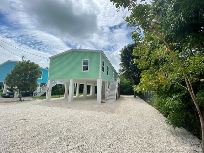 Front with covered parking - 19590 Tequesta St