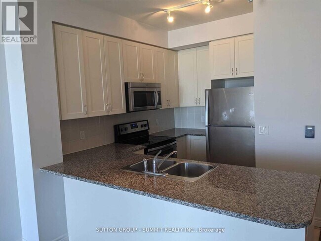 Photo du bâtiment - 339-339 Rathburn Rd W