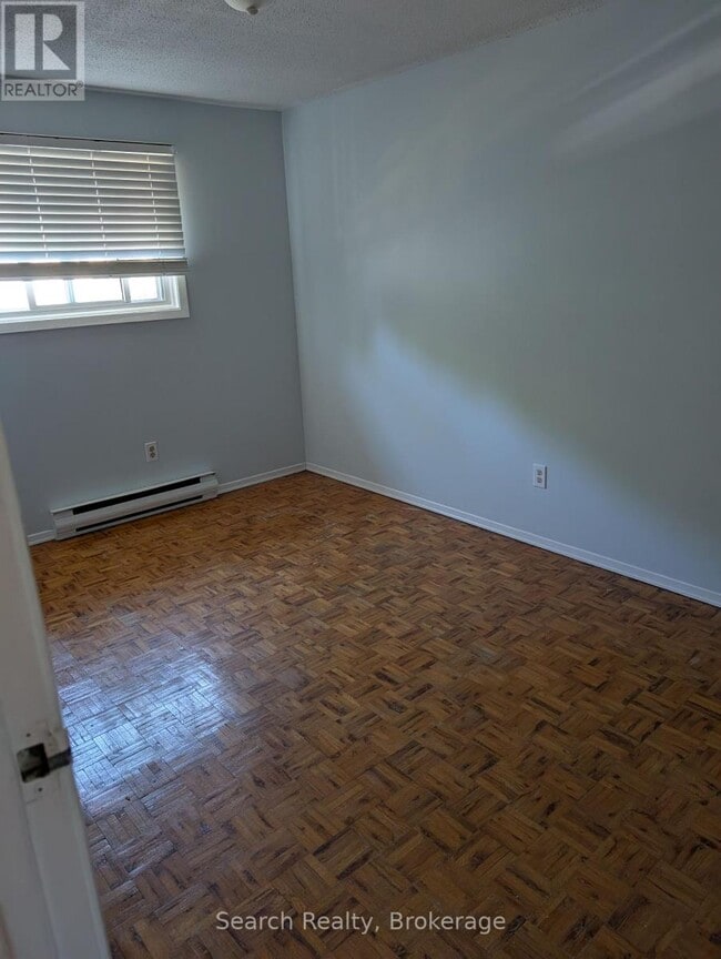 Photo du bâtiment - 311-311 Vesta Rd
