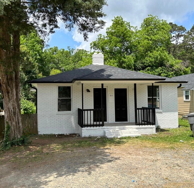 Both doors have access to the house. Right side to living room and left is a bedroom or living space - 305 Orange St