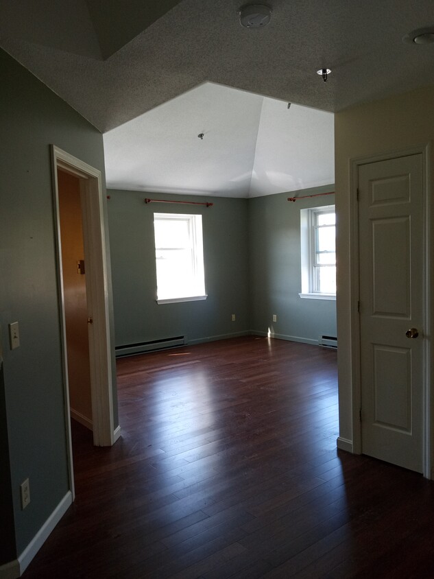 living room, entrance to master bedroom on left - 28 Academy St