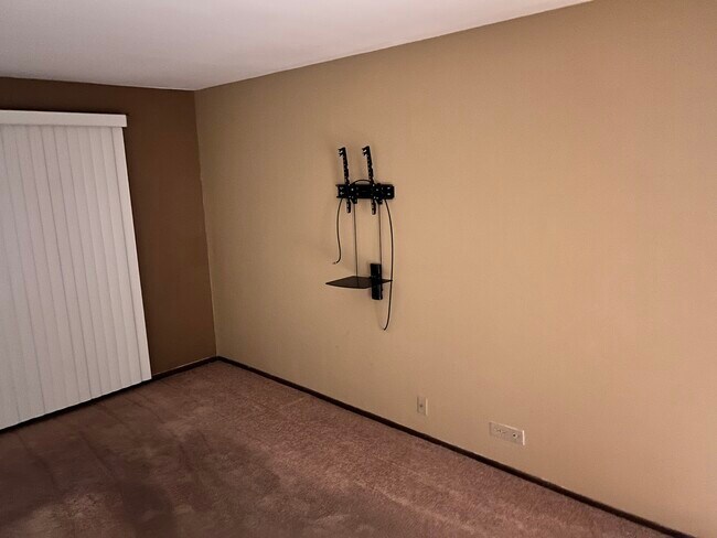 Master bedroom. TV mount and media shelf. - 4315 Lindenwood Dr