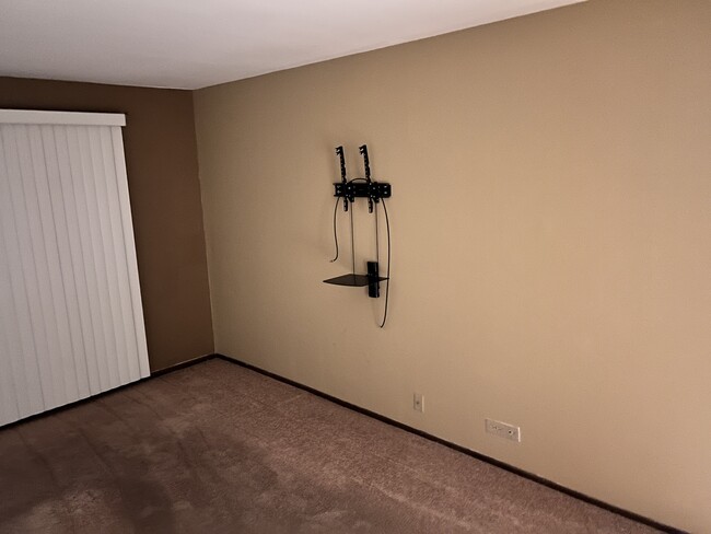 Master bedroom. TV mount and media shelf. - 4315 Lindenwood Dr