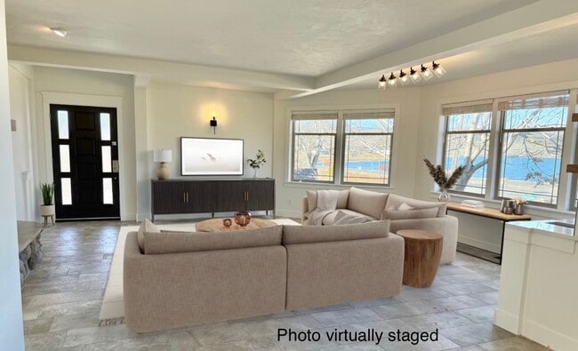 Virtually staged living room with view of lake - 24 Ash St N