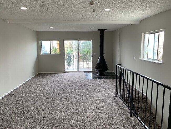 Gas fireplace, balcony and upstairs living room - 813 15th St