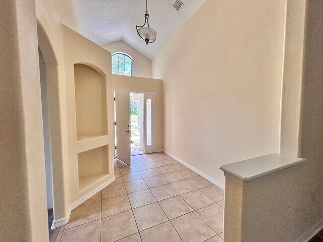 Building Photo - Large 4/2 with new floors in gated community!