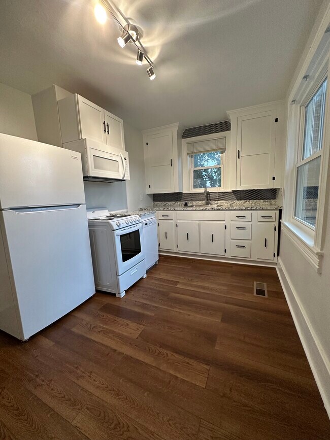 Completely updated kitchen with all new appliances and hard wood floors. - 942 Russell St