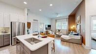 Located at 1617 Enid St in Houston, TX, this thoughtfully designed 2-bedroom, 2-bathroom single-story home offers a comfortable and modern living experience. The open-concept layout seamlessly connects the kitchen, dining area, and living room, creating a bright and inviting communal space bathed in natural light from large windows. Light wood-look flooring flows throughout the main living areas, adding warmth and continuity.

The kitchen is a standout feature, showcasing two-tone cabinetry with white upper cabinets and gray lower cabinets, a decorative tile backsplash, white quartz countertops, stainless steel appliances, and a central island with bar seating. A pantry provides additional storage convenience.

The living room offers a cozy yet spacious feel, highlighted by a warm accent wall and ample natural light. Both bedrooms are well-sized and carpeted, offering a restful retreat. The primary bedroom includes generous closet space with built-in shelving and hanging rods. Each bathroom is finished with light wood-look flooring, gray vanity cabinetry, quartz countertops, and backlit mirrors. The primary bath also features a soaking tub with large-format tile surround. A dedicated laundry area and multiple closets round out this well-organized home.