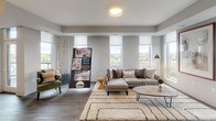 Located at 2510 Riverside Ave in Minneapolis, MN, this single-floor residence at Luna Minneapolis offers a thoughtfully designed layout with modern finishes throughout. The bright and airy living room is a standout feature, boasting large windows that flood the space with natural light and offer views of the surrounding cityscape. Wood-plank flooring and neutral tones create a clean, contemporary aesthetic that flows seamlessly through the common areas. The kitchen is outfitted with stainless steel appliances, including a gas range, microwave, and French door refrigerator, complemented by sleek white cabinetry and a light stone countertop. The bedrooms are generously proportioned, each featuring plush carpeting, large windows with city views, and ample closet space. The two bathrooms are well-appointed: one features classic white subway tile surrounding a soaking tub, a modern vanity with an integrated sink, and wood-look flooring, while the second offers a soaking tub with a curved shower rod and matching wood-look flooring. Throughout the unit, the design emphasizes clean lines, neutral palettes, and functional layouts, making for a comfortable and stylish urban living experience in Minneapolis's vibrant West Bank neighborhood.