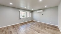 Located at 3313 N Maple Ave in Fresno, CA, this thoughtfully updated single-story unit offers a well-designed layout across one bedroom and one bathroom. The living room greets you with a welcoming front entry door featuring a decorative transom window, warm wood-look flooring, soft neutral gray walls, and a classic ceiling fan with light fixture — creating a comfortable and inviting atmosphere. Natural light filters in through multiple windows, enhancing the bright, airy feel throughout.

The kitchen is outfitted with crisp white shaker-style cabinetry, dark gray countertops, a stainless steel double-basin sink with a modern pull-down faucet, and a stainless steel range and over-the-range microwave, offering both style and functionality in a compact, efficient space.

The bedroom provides a comfortable retreat, highlighted by large windows offering outdoor views, the same wood-look flooring as the rest of the unit, and a wall-mounted Fujitsu ductless mini-split system for personalized climate control. Recessed lighting adds a clean, modern touch.

The bathroom features a full tub and shower combination enclosed by sleek sliding glass doors with chrome hardware, paired with a white vanity and tile flooring, delivering a clean and contemporary finish. The consistent use of neutral tones and modern updates throughout creates a cohesive, move-in ready space.
