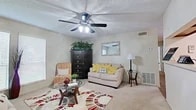 Located at 210 St. Louis Ave in Bossier City, Louisiana, this two-bedroom, two-bathroom residence offers a well-organized single-floor layout designed for comfortable everyday living. The living room serves as the heart of the home, featuring soft carpeting, a ceiling fan with integrated lighting, a textured ceiling, and a bright window that allows natural light to fill the space with a warm, inviting ambiance. Adjacent to the living area, the dining space is defined by wood-look flooring and built-in shelving, creating a charming nook ideal for gathering. The kitchen is equipped with warm wood-toned cabinetry, a white appliance suite including a range and refrigerator, and durable flooring that ties the cooking and dining areas together seamlessly. The primary bedroom is a generously sized retreat with plush carpeting, a ceiling fan, and a spacious closet, while the second bedroom offers a cozy and functional layout equally well-suited for rest or use as a home office. Both bathrooms feature warm wood vanities with white countertops, large mirrors, and efficient layouts. Throughout the home, neutral wall tones and consistent finishes contribute to a cohesive, move-in-ready aesthetic that balances practicality with comfort.