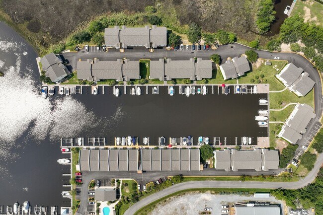 Building Photo - Welcome to Coastal Living at Harbor Landing Condominiums!