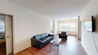 Located at 800 W Hovey Ave in Normal, IL, this 4-bedroom, 4-bathroom unit offers a functional and well-organized layout across a single floor. The open living room features rich hardwood-style flooring, neutral walls, and a large window that fills the space with natural light — ideal for both relaxing and entertaining. Adjacent to the living area, the kitchen is generously sized and equipped with warm wood cabinetry, dark granite-style countertops, a black appliance suite including a range, dishwasher, and refrigerator, and ample storage throughout. Each of the four bedrooms is carpeted for comfort and includes a ceiling fan with lighting, a dedicated closet, and its own private bathroom. The bedrooms provide a quiet, personal retreat, with select rooms featuring windows that bring in additional natural light. Each bathroom mirrors a consistent design with wood-toned vanity cabinetry, a medicine cabinet, a single sink, and hardwood-style flooring. The primary bedroom offers a notably generous footprint compared to the other rooms. This unit's layout and private per-bedroom bathrooms make it a practical and comfortable option for shared living in Normal, IL.