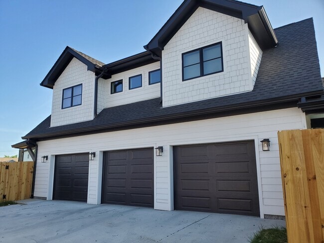 2-car garage provides security and even more storage space! (3rd garage belongs to upstairs apt.). - 1021 Cheatham Pl