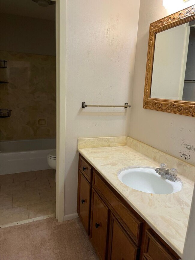 Building Photo - Introducing a 2-bedroom, 1.5-bathroom condo that offers the perfect blend of comfort and convenie...