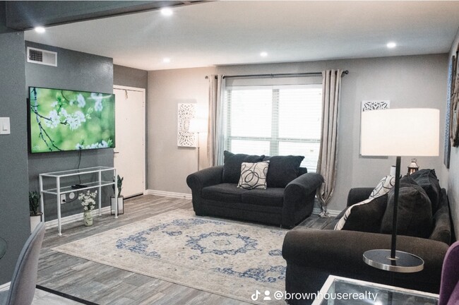 Living room with smart tv and pool view - 10216 Regal Oaks Dr