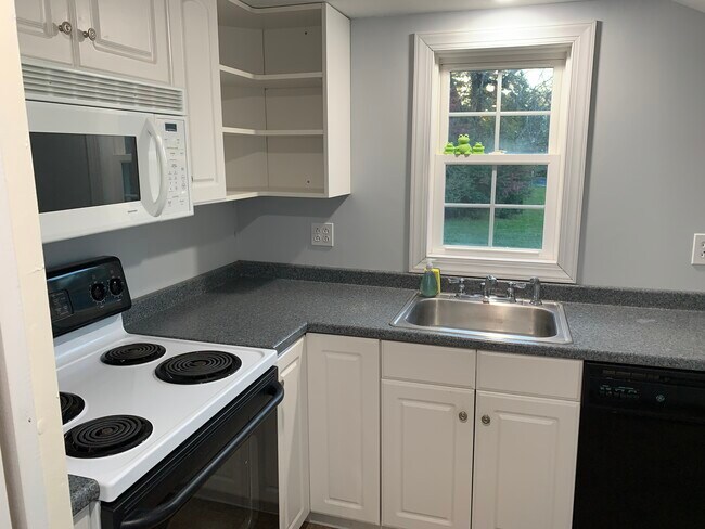 Kitchen with oven, stove, microwave, refrigerator and dishwasher. - 741 Cherry Valley Rd