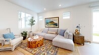 Located at 15912 Chase Rd in Fontana, California, this well-designed two-story home offers three bedrooms and three bathrooms with a clean, modern aesthetic throughout. Light wood-tone flooring flows consistently across both levels, complementing the bright white walls and recessed lighting that create an airy, welcoming atmosphere.

The main floor opens into a spacious combined living and dining area bathed in natural light from multiple windows and a glass sliding door. The living room features recessed lighting and offers a comfortable, open feel that connects seamlessly to the dining space. The kitchen is thoughtfully designed with white shaker cabinetry extending to the ceiling for maximum storage, stainless steel appliances including a French door refrigerator and range, and light quartz countertops.

A convenient half bathroom is also located on the main floor. Upstairs, the layout expands to accommodate three well-proportioned bedrooms, including a primary suite with a dedicated closet featuring built-in shelving and hanging rods. A bright hallway landing with windows provides a pleasant transitional space between rooms. All bedrooms offer natural light and clean finishes. The upper level also includes a dedicated laundry room with a stacked washer and dryer and additional cabinetry. Three full bathrooms serve the home, each finished in a simple, modern style.
