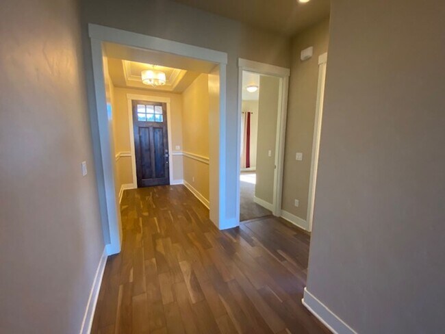 Building Photo - Custom home looking over Rivers Edge golf course