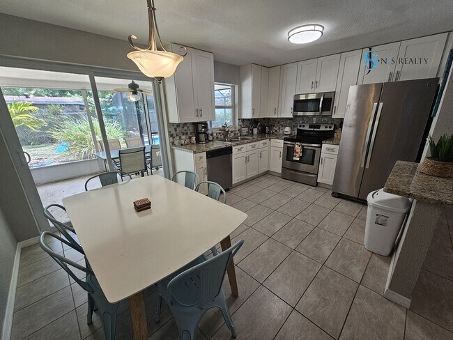 Building Photo - JUST REDUCED... must see beautiful 3/2 1071 Sq. Ft. with a POOL!! Gorgeous updated Kitchen & bath...
