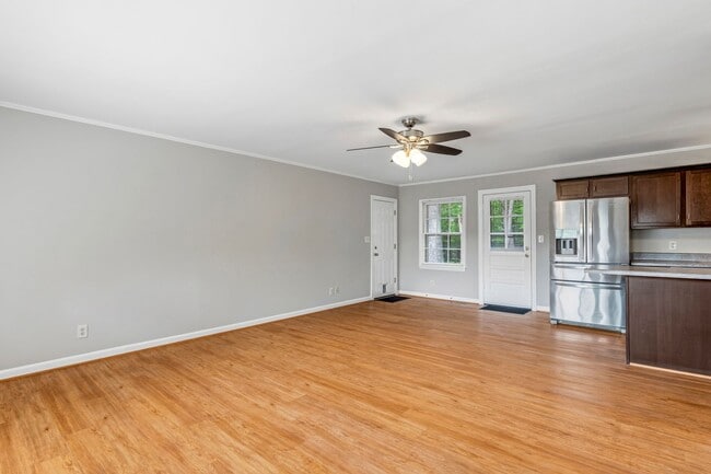 Building Photo - Updated Home, Stainless Steel Appliances, Wood Like Flooring, Deck, Garage!