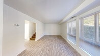 Located at 1319 Johnstons Rd in Norfolk, Virginia, this two-floor home offers a clean, functional layout with bright, neutral interiors throughout. The main living area on the first floor is spacious and welcoming, featuring light-toned hardwood-style flooring and large windows fitted with blinds that allow ample natural light to fill the room. A staircase connects the two floors, providing easy access between the living spaces.

The kitchen is well-appointed with crisp white shaker-style cabinetry, granite-look countertops, and a full suite of stainless steel appliances including a gas range, built-in microwave, and dishwasher. Light wood-style flooring continues through the kitchen, and vertical blinds on a nearby window add a practical touch.

The upper level features carpeted bedrooms with clean white walls, offering a comfortable and quiet retreat. Bedrooms are equipped with closets, including sliding-door closet storage, providing convenient organization. Windows in each bedroom bring in natural light and views of the surrounding neighborhood.

Throughout the home, the consistent use of white walls and light flooring creates a bright, cohesive aesthetic. The straightforward layout and updated finishes make this Norfolk property a practical and comfortable two-story home.