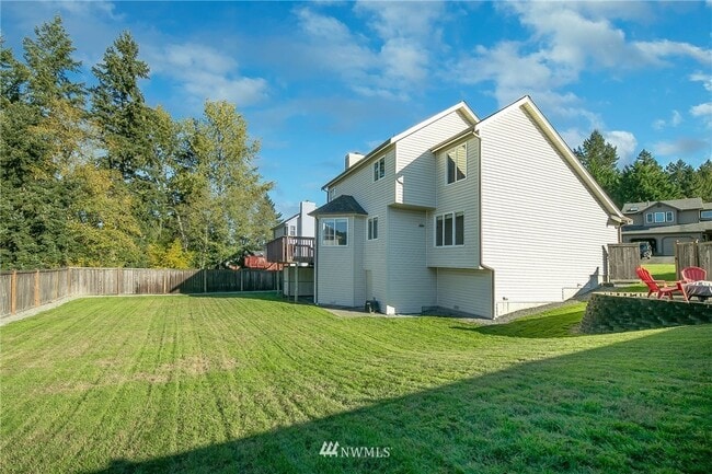 Large fully fenced backyard - 9781 Enchantment Ave NW