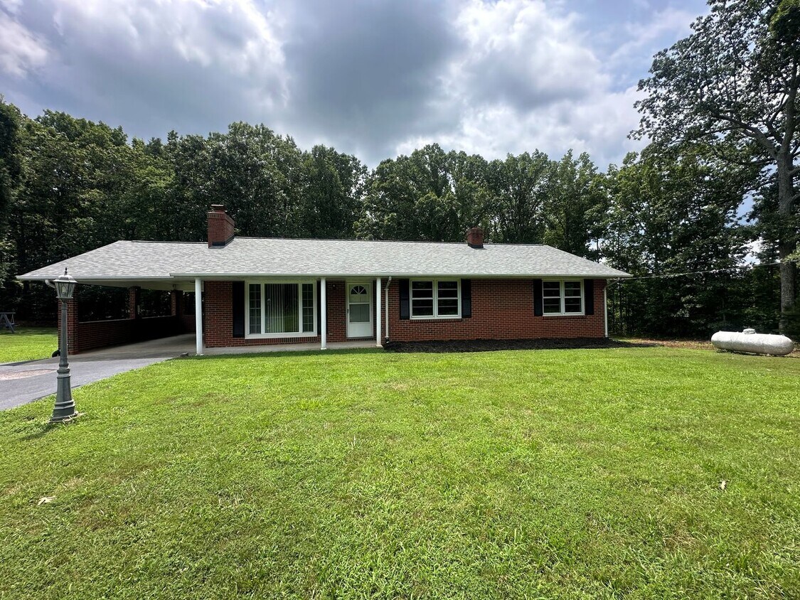 Primary Photo - Spacious brick house with a caport and unf...