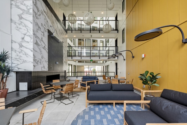 Building Photo - Atrium - Welcome to South Seattle’s Newest Modern Living Experience — Steps From the Light Rail